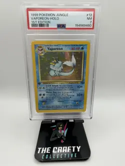 1999 POKEMON JUNGLE SET - #12 VAPOREON [1ST EDITION] HOLO - PSA 7 - Image 1