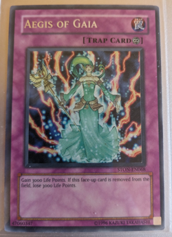 Yugioh Aegis of Gaia STON-EN068 Secret Rare Strike of Neos Unlimited MP - Image 1