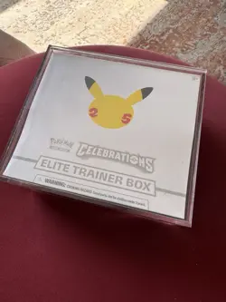 Pokemon Tcg Etb Celebrations 25 Th Sealed Whit Plexiglas Display - Image 1
