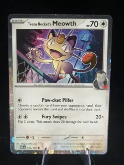 Team Rocket's Meowth Cosmos Holo 149/182 Destined Rivals Card - Image 1