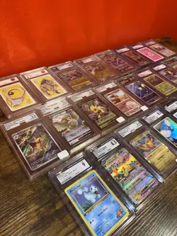 Pokemon Lot Of 25 Mixed Graded Slabs CGC TAG + more See Photo! - Image 1
