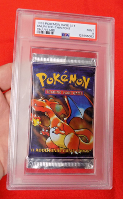 1999 POKEMON BASE SET UNLIMITED UNOPENED FOIL PACK THIN FONT CHARIZARD PSA 9 - Image 1