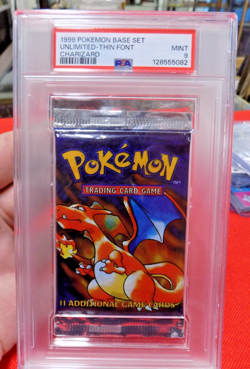 1999 POKEMON BASE SET UNLIMITED UNOPENED FOIL PACK THIN FONT CHARIZARD PSA 9 - Image 3