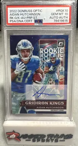 2022 Optic Aidan Hutchinson Rookie Gridiron Kings Auto-Purple Stars /25 PSA 10 - Image 1