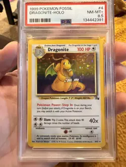 1999 Pokemon TCG Fossil Dragonite Holofoil Card 4/62 PSA 8.5 NM-MT+ - Image 1