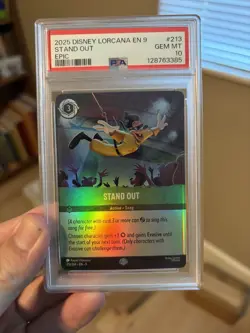 2025 DISNEY LORCANA EN 9-FABLED EPIC #213 STAND OUT PSA 10 - Image 1