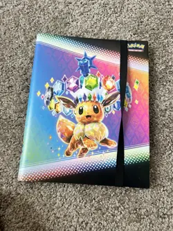 Pokemon TCG Scarlet & Violet Prismatic Evolutions Eevee 9-Pocket Album Strap - Image 1