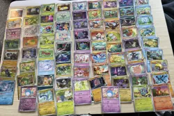 75 Cute Pokemon TCG Mixed Card Lot Holo/Reg Charmander Shinx, Rayquaza, More - Image 1