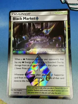 Black Market 134/181 Team Up Ultra Rare Prism Star Stadium Pokemon Card - Image 1