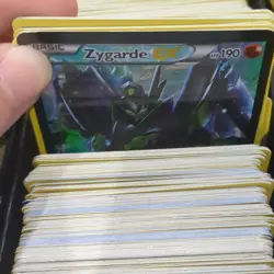 1200+ Pokemon TCG Card Lot w/ Storage Tins, etbs, a playing mat, & Deck Boxes - Image 2