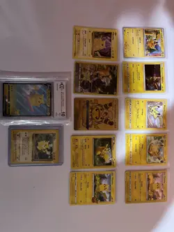 Pikachu 12 Card Mixed Lot Includes BCCG 10 2021 Celebrations Surfing Pikachu V - Image 1