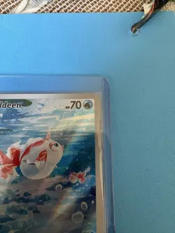 Goldeen 087/084 Illustration Rare Holo Pitch Black Pokemon Card in Hand - Image 3