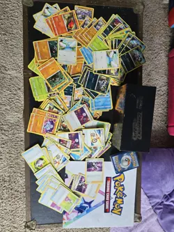 Pokemon Card Lot: 100+ Cards + Unopened Sealed Deck & Storage Box - Image 1