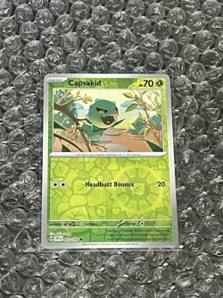 Capsakid 012 Sv08: Surging Sparks Reverse Holo Pokemon NM - Image 1