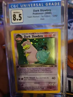 2000 POKEMON TEAM ROCKET 1ST EDITION HOLO #12/82 DARK SLOWBRO CGC 8.5 - Image 1