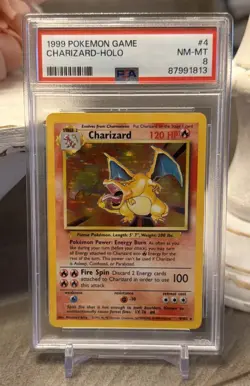 1999 POKEMON BASE SET UNLIMITED #4 CHARIZARD-HOLO PSA 8 - Image 1