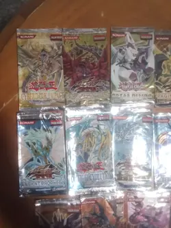Collection of open Yu-Gi-Oh booster packs. - Image 2
