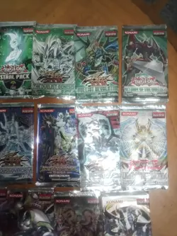 Collection of open Yu-Gi-Oh booster packs. - Image 4