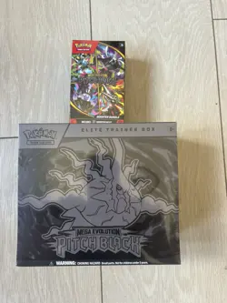 Pokemon Pitch Black ETB and booster bundle in hand - Image 1