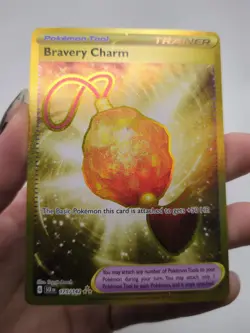 Bravery Charm 175/142 Gold Hyper Rare 2024 Pokemon Stellar Crown Card NM - Image 1