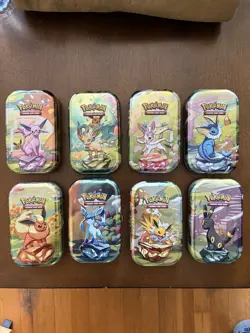 NO PACKS Pokemon Prismatic Evolutions Mini Tins Set of 8 With Coins & Art Cards - Image 1