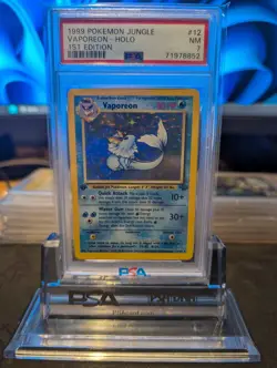 1999 POKEMON JUNGLE 1ST EDITION #12 VAPOREON - HOLO PSA 7 NM LOW POP! - Image 1