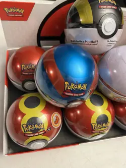 Pokemon TCG Lot of 9 Poke Ball Tin Factory Sealed New W/Display case. - Image 3