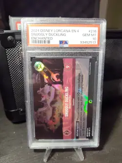DISNEY LORCANA EN 4-URSULA'S RETURN SNUGGLY DUCKLING - DISREPUTABLE PUB PSA 10 - Image 1