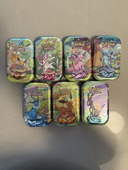 Pokemon TCG Prismatic Evolutions Mini Tin - 7 Factory Sealed Tins - Image 1