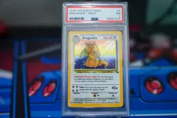 1999 POKEMON FOSSIL #4 DRAGONITE-HOLO PSA 7 - Image 1