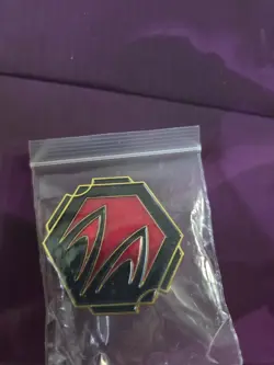 Lorcana TCG Whispers in the Well League Promo Disney Pin: Ruby Ink Symbol - Image 1