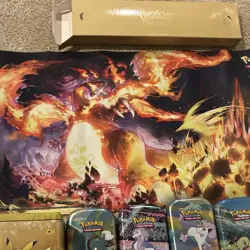 Pokemon tins,coins,charzard mat,evolving skies player guide,gold cards - Image 5