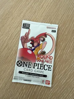 One Piece x Round 1 Promo Pack - 1 Card Sealed One Piece TCG Promo - Image 1