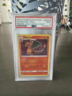 Pokemon 2019 Black Star Holo Promo Chest Charizard #SM226 PSA 9 - Image 1
