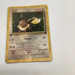 DMG - German Evee (Evoli) Team Rocket First Edition Pokemon TCG 55/82 Damaged - Image 1