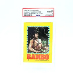 1985 Topps Rambo II #3 Holding Knife PSA 8 Sticker First Blood Stallone - Image 1