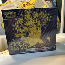 Pokemon Scarlet & Violet Surging Sparks ETB New Factory Sealed With Small Tear. - Image 1