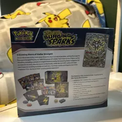 Pokemon Scarlet & Violet Surging Sparks ETB New Factory Sealed With Small Tear. - Image 3