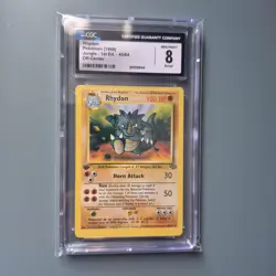 CGC 8 Mint Rhydon Base Set 1st Edition Off Center Error Pokemon Card - Image 1