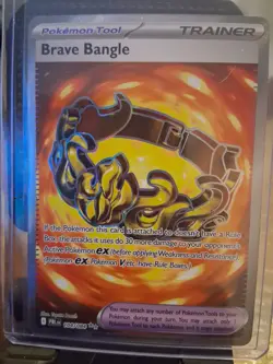 Brave Bangle PBL: Pitch Black 104/084 Unc Reverse Holo Pokemon Tool EN - Image 1