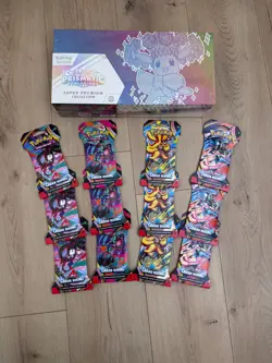 Pokemon Prismatic Evolutions Super-Premium Box + 12 Chaos Rising & 2 PO Packs - Image 1