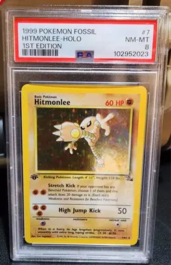 POKEMON HITMONLEE 1999 FOSSIL 1ST EDITION #7 HOLO PSA 8 - Image 1