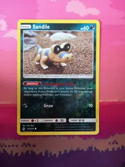 Pokemon Card Sandile Unbroken Bonds Reverse Holo 113/214 Near Mint - Image 1