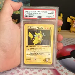 PSA 8 Pokemon TCG 2000 Gym Heroes Lt. Surge's Pikachu 1st Ed 081/132 Regular - Image 1