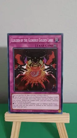 2025 Yugioh Eldlixir Of The Glorious Golden Land Trap Card ALIN-EN077 Super Rare - Image 1