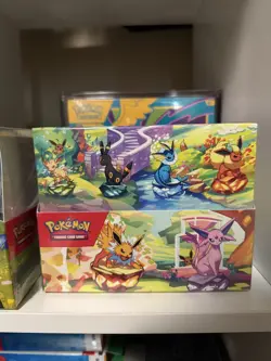 Pokemon TCG Prismatic Evolutions Mini-Tin Display (8 Tins) – Factory Sealed - Image 1