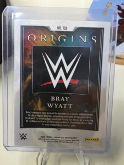 2023 Panini Chronicles WWE - Origins Bray Wyatt #133 Blue /99 - Image 2