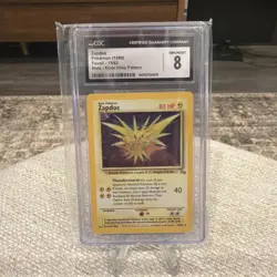 CGC 8 NM/MINT Zapdos 15/62 Fossil Error Holo Pattern Holo Pokemon Card - Image 1
