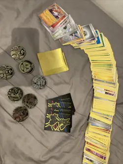 Lots Of Pokemon Cards, Sleeves And Tokens - Image 1