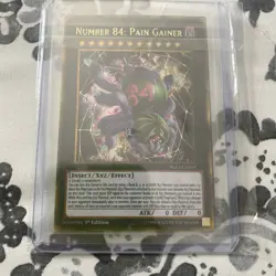 Yugioh Number 84: Pain Gainer PGL3-EN010 Gold Secret Rare 1st Edition Near Mint - Image 1